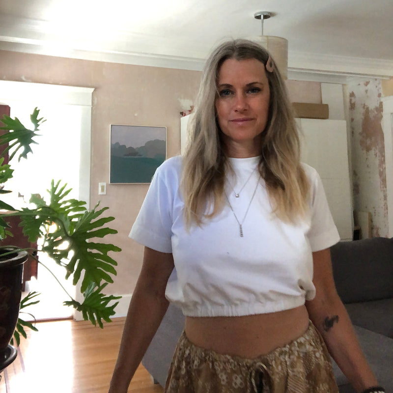 white cotton t-shirt with an elastic waistband hem