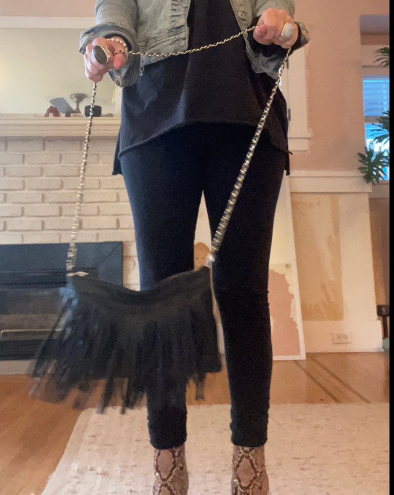 pleather, black fringe purse with woven, gold chain shoulder strap in black